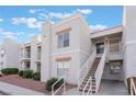 Two-story building exterior with stairs and landscaping at 6800 E Lake Mead Blvd # 2035, Las Vegas, NV 89156