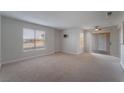 Bright living room with patio access and carpet at 6800 E Lake Mead Blvd # 2035, Las Vegas, NV 89156
