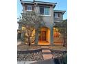 Charming home featuring a stucco facade, arched entry, and well-maintained landscaping at 1324 Spice Ridge Ct, Henderson, NV 89012