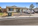 Charming single-story home featuring low maintenance landscaping and a paved driveway leading to an attached garage at 204 Cimarron Ct, Henderson, NV 89002