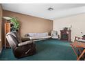 Cozy living room with neutral paint and a fireplace provides a warm and inviting atmosphere at 204 Cimarron Ct, Henderson, NV 89002