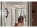 Inviting hallway with hardwood floors, neutral walls, and an elegant lighting fixture at 2777 Paradise Rd # 1105, Las Vegas, NV 89109