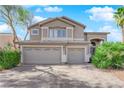 Two-story house with a three-car garage and landscaped yard at 2891 Painted Lilly Dr, Las Vegas, NV 89135
