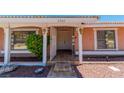 House entrance with a white door and decorative gate at 3360 Paso Andres St, Las Vegas, NV 89146
