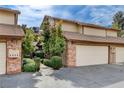 Brick building exterior with attached garages and landscaping at 3449 Lorilou Ln # 3, Las Vegas, NV 89121