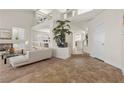 Spacious living area featuring an open floor plan, a fireplace, and neutral tones at 4439 Melrose Abbey Pl, Las Vegas, NV 89141