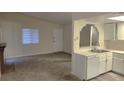 Modern kitchen with white cabinets and stainless steel appliances at 4708 Obannon Dr # C, Las Vegas, NV 89102