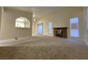 Bright living room featuring a fireplace and carpet flooring at 4708 Obannon Dr # C, Las Vegas, NV 89102