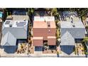 Aerial view of houses with backyard pools and solar panels on the roofs at 5873 Corazon Dr, Las Vegas, NV 89103