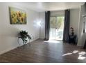 Bright living room with hardwood floors and sliding glass doors at 6250 W Flamingo Rd # 88, Las Vegas, NV 89103