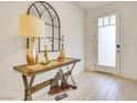 Bright entryway with console table, lamp, and modern decor at 8136 Little Skye Ct, Las Vegas, NV 89166