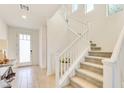 Modern staircase with white railings and carpeted steps at 8136 Little Skye Ct, Las Vegas, NV 89166