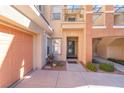 Townhome featuring a private front entrance, two-car garage, and inviting curb appeal at 830 Cozette Ct # 102, Las Vegas, NV 89144