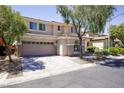 Attractive two-story house featuring a two-car garage and a neatly landscaped front yard at 8651 Moreno Mountain Ave, Las Vegas, NV 89178