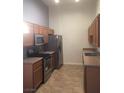 Kitchen with stainless steel appliances and wood cabinets at 8985 S Durango Dr # 2094, Las Vegas, NV 89113