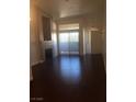 Living room with fireplace and sliding glass doors at 8985 S Durango Dr # 2094, Las Vegas, NV 89113