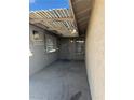 Covered entryway with light-grey walls and wood pergola at 11 Page St, Las Vegas, NV 89110