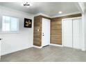 Bright entryway with wood-look wall accents, tile flooring, and a closet at 1470 Sutton Dr, Pahrump, NV 89048