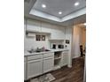 Well-lit kitchen with white cabinets and a double sink at 200 N Bruce St # A, Las Vegas, NV 89101