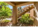 Covered patio with stairs and green landscaping at 2110 Los Feliz St # 1046, Las Vegas, NV 89156