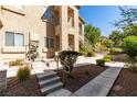 Ground level entrance with landscaping and walkway at 2110 Los Feliz St # 1046, Las Vegas, NV 89156