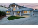 Charming home boasts a well-manicured lawn, tiled roof, and inviting entrance, enhancing its curb appeal at 2327 River City Dr, Laughlin, NV 89029