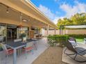 Inviting outdoor patio with dining area, bar seating, and a covered pergola, perfect for entertaining guests at 3416 Calle De Corrida, Las Vegas, NV 89102