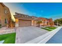 Beautiful home with a large driveway and manicured lawn at 61 Contrada Fiore Dr, Henderson, NV 89011