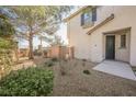 Front entry of townhome with landscaping and walkway at 7332 Marble Lake St # 103, Las Vegas, NV 89149