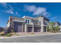 Contemporary home with stone accents and three-car garage at 8541 S Pioneer Way, Las Vegas, NV 89113