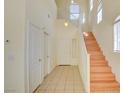 Bright entryway with staircase and tile flooring at 8557 Nature Scene Dr, Las Vegas, NV 89139
