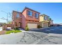Two story townhome with attached garage, next to similar unit at 8557 Nature Scene Dr, Las Vegas, NV 89139
