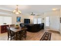 Elegant dining room with dark wood table and a view of living room at 1120 Casady Hollow Ave, Henderson, NV 89012