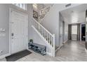 Welcoming home foyer features tile flooring, staircase and view into other parts of the home at 190 Mount Saint Helens Dr, Henderson, NV 89012