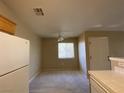 Simple dining area with carpeted floor and ceiling fan at 2110 Los Feliz St # 2052, Las Vegas, NV 89156