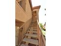 Close up of tan outdoor staircase leading to apartments in the building at 2110 Los Feliz St # 2052, Las Vegas, NV 89156