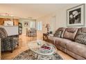 Open living space with hardwood floors and a view into dining area at 3055 Key Largo Dr # 203, Las Vegas, NV 89120
