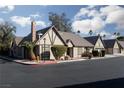 Attractive tan house with a brown roof and landscaping at 3990 Avebury Pl, Las Vegas, NV 89121