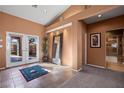 Bright entryway with tile floor, double doors opening to a patio, and a full bath at 479 Via Ventana Dr, Mesquite, NV 89027
