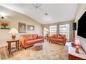 Inviting living room with comfortable seating, natural light, and a ceiling fan at 5105 Kingsbridge Dr, Las Vegas, NV 89130