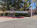 Silver Pines community entrance with attractive landscaping at 10524 Pine Gardens Ct # 203, Las Vegas, NV 89144