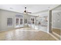 Bright and airy living room with tile floors, access to backyard at 10923 Royal Highlands St, Las Vegas, NV 89141