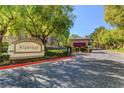 Gated community entrance with attractive landscaping at 1700 Hills Of Red Dr # 202, Las Vegas, NV 89128