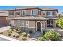 House exterior featuring a large front yard and landscaping at 2920 Josephine Dr, Henderson, NV 89044