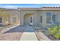 Inviting front entry with a walkway and drought-tolerant landscaping at 5915 Ablette Ave, Las Vegas, NV 89122