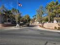 Community entrance to Ironwood Condominiums with flag and signage at 8309 Cherry Glaze Ave # 201, Las Vegas, NV 89145