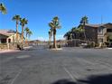 Exterior view of a community gate surrounded by palm trees and well-maintained landscaping at 8985 S Durango Dr # 2062, Las Vegas, NV 89113