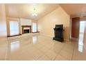 Spacious living room featuring a fireplace and tile flooring at 1009 Winwood St, Las Vegas, NV 89108