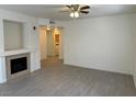 Bright living room featuring a fireplace and laminate flooring at 10290 Gilmore Canyon Ct # 103, Las Vegas, NV 89129