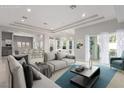 Bright living room with modern furniture, open layout, and lots of natural light at 11554 Lampeter Ct, Las Vegas, NV 89138